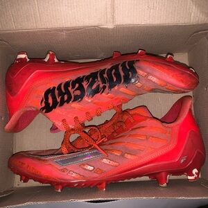 Orange and red adidas cleats